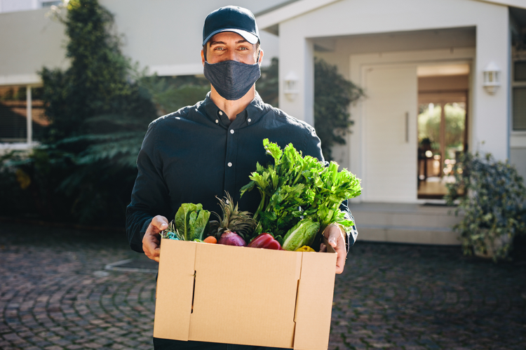 Man holding a box of groceries